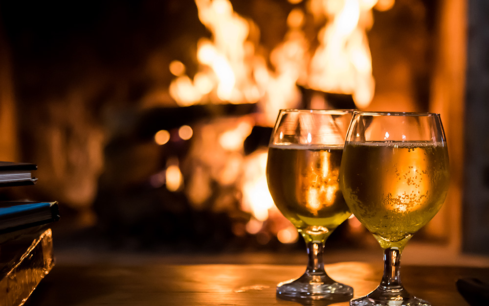 Wine served beside the fire at the lodge