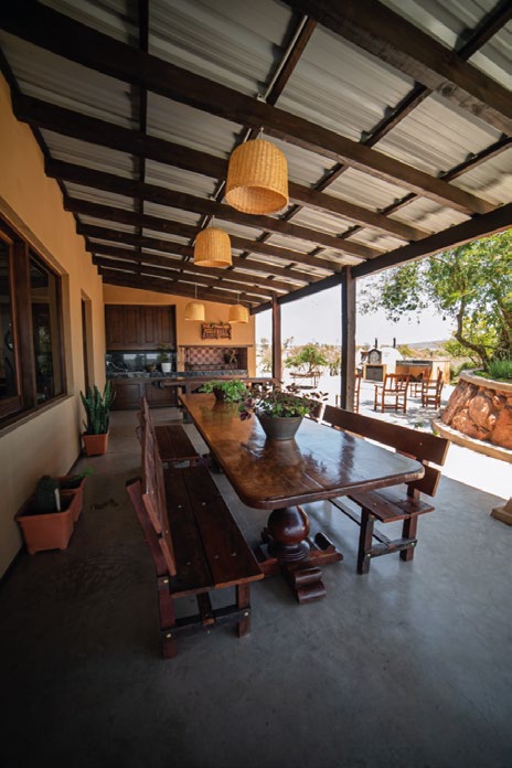 Covered outdoor dining veranda at Estancia La Dorada