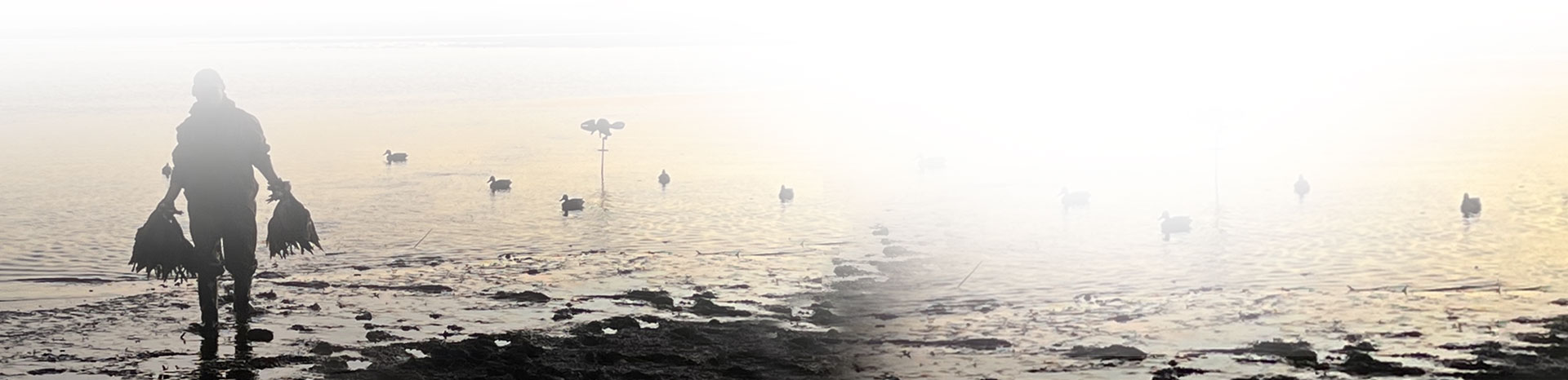 A waterfowler crossing an Argentine wetland